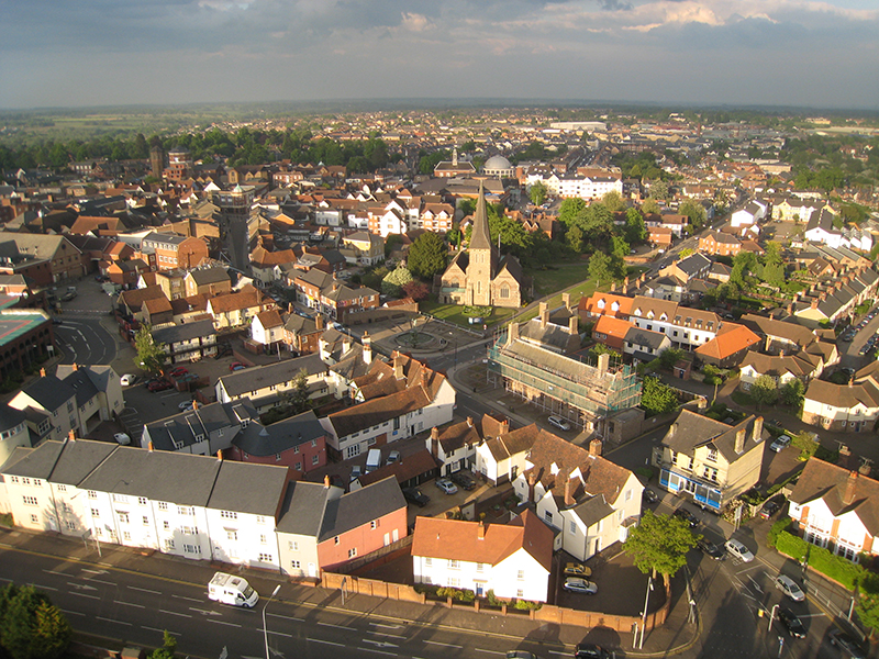 Black Notley is one of the three "Notleys" in Essex near Chelmsford. This is a great aerial picture on a balloon ride floating close to the spire of the local church St Peter and St Paul Black Notley just before landing at the nearby farm in a cut grass field