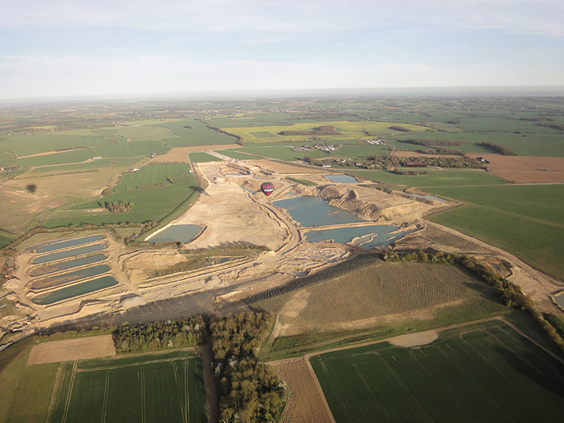 An Essex Balloon ride flies over the remains of Rivenhall Airfield at Silver End. Most of the runways have been dug up for construction material and beneath the natural gravel is now being extracted for the same purpose. A second view is from the balloon basket flying low level over the Essex countryside close to Silver End village which was home to the Crittall Windows production facility when it expanded from Braintree in 1926