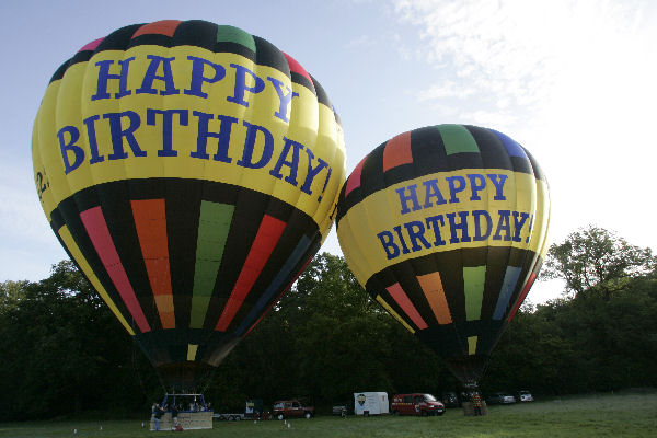 Treat someone special to a great gift for their birthday but giving them a flight in one of our happy birthday balloons. Essex Balloons is the only air balloon rides operator providing this opportunity in our new 16 passenger happy birthday balloon. As with all of our balloon rides over Essex the happy birthday balloon experience lasts between 3-4 hours including an hour of flight, inflating and packing away the balloon certificate ceremony and champagne toast. Passengers can assist with the inflation and packing away of the balloon if they like and spectators are always welcome to watch the balloon launch. Contact us today to see if our happy birthday balloon is available for the date you want