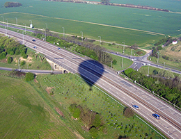 The hot air balloon castes a shadow over the A12 near Chelmsford